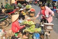 Womand selling fruits and vegetables in a street market of HoÃÂ n KiÃ¡ÂºÂ¿m, the old quarter of Hanoi Royalty Free Stock Photo